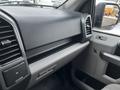 Dashboard of a 2017 Ford F-150 featuring a flat black panel with air vents and controls for the vehicle's interior functions