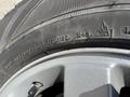 Close-up of a tire from a 2013 Ford Expedition showing the tread pattern and sidewall details including tire size and markings