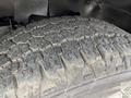 Close-up of a worn tire tread on a 2020 Chevrolet Express showing deep grooves and rough texture