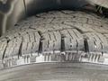 Close-up of the tread and sidewall of a tire from a 2006 Land Rover LR3 showing deep grooves and rugged texture for off-road performance