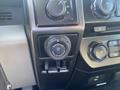 Close-up of a 2017 Ford F-150 control panel featuring the trailer backup knob with labeled functions and additional control buttons