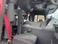 Interior view of a 2006 E-One Typhoon fire truck showing the driver's seat dashboard controls and safety features