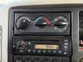 Dashboard of a 2011 International WorkStar showing temperature controls and a radio display indicating the time as 958 AM