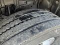 Close-up of a worn tire on a 2014 Hino 195 showing uneven tread wear and exposed inner layers