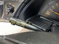 Close-up of the control stalk inside a 1992 Chevrolet Corvette showing wiper and cruise control functions