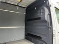 Interior view of a 2019 Mercedes-Benz Sprinter showing the cargo area with gray walls and a flat floor