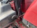 A 2012 Toro Groundsmaster 5910 featuring a seat with levers and a red body showing signs of use and dirt accumulation