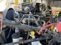 The image shows the engine compartment of a 2010 International 4300 featuring various hoses wires and components with a focus on the intricate arrangements of the engine parts
