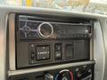 A car stereo system with Bluetooth capabilities and various control buttons mounted in the dashboard of a 2017 Hino 338 vehicle