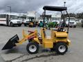 A 2024 AGT Industrial KRW23 Mini Loader with a yellow body and a black front bucket, equipped with wheels and a seated operator area