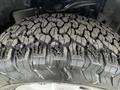 Close-up of a rugged tire with deep treads designed for off-road driving mounted on a 2017 Ford F-150