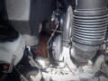 Close-up view of the engine components of a 2016 International WorkStar 7500 showing the turbocharger and air intake hose