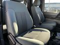 Two gray front seats of a 2011 Ford F-350 SD interior with textured fabric and armrests