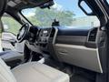 Interior view of a 2017 Ford F-550 showing the dashboard controls seating area and steering wheel