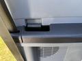 Close-up of the interior door handle of a 2016 Ford F-550 showing the latch mechanism and surrounding panel design