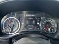 Dashboard of a 2019 RAM 1500 showing the vehicle's speedometer and various gauges for engine hours and vehicle information