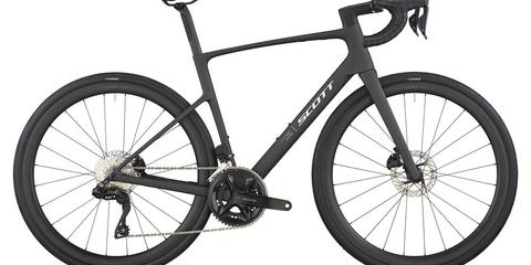 A 2026 Scott Addict 30 road bike in a sleek black finish featuring drop handlebars disc brakes and a lightweight frame designed for performance and speed