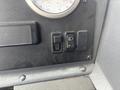 Control panel of a 2006 E-One Typhoon showing a gauge and two switches one for fog lights with a green indicator light
