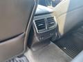 Interior detail of a 2017 Acura TLX showing the rear air vents and seat controls on the back of the front seat