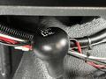 A black four-wheel drive transfer case lever with markings for 2H 4H N and 4L