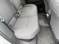 The rear seats of a 2025 Toyota Corolla with gray upholstery and seat belts visible
