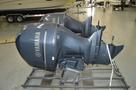 Two Yamaha outboard motor engines positioned on a metal frame