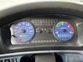 The dashboard display of a 2006 Hino 268 showing speedometer odometer and various indicator lights
