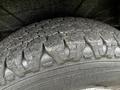 Close-up of a tire with a rugged tread pattern designed for grip and durability commonly found on a 2018 RAM Promaster