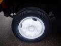 Close-up of a white wheel with multiple bolts from a 2008 Freightliner MT45 chassis showcasing a black tire