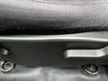 Close-up view of the seat adjustment lever on a 2011 GMC Sierra 3500HD truck seat