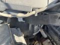 Close-up view of a 2016 Ford Transit engine compartment showcasing various hoses and components connected to the engine
