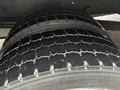 Close-up of a 2018 Ford E-450 tire showcasing its tread pattern and texture