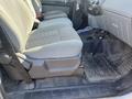 Interior view of a 2015 Ford F-450 SD showing the front seats and floor mat