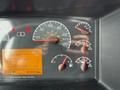 Dashboard of a 2012 Volvo VNL showing speedometer fuel gauge engine hours and warning lights