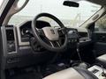 Interior of a 2012 Dodge Ram 5500 featuring a steering wheel dashboard controls and gear shift with leather seats
