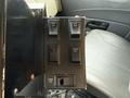 Controls for various lights and equipment on the dashboard of a 2016 International 7600 including switches for front light right rear and sander roto