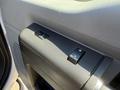 Close-up of the power window control panel on a 2014 Ford F-250 SD featuring buttons for window operation