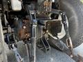 A close-up view of the rear assembly of a 2018 New Holland Boomer 45 tractor showing the hitch and linkage components