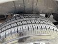 A close-up of a tire from a 2016 Mercedes-Benz Sprinter showcasing the tread pattern and rubber detail
