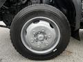 A close-up view of a silver wheel rim on a tire from a 2014 Hino 195 truck with visible tire tread patterns and Michelin branding