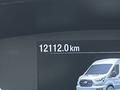 A digital display showing a white 2023 Ford Transit with an odometer reading of 12112 km