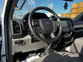 Interior view of a 2021 Ford F-550 focusing on the steering wheel dashboard and controls
