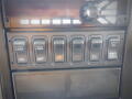 Control panel with various switches labeled for functions like lock, diff, and park regen on a 2016 International WorkStar 7500