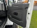 Interior door panel of a 2008 International 7500 truck featuring a black handle and armrest
