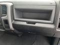 The image shows the interior dashboard of a 2019 RAM 1500 Classic featuring a storage compartment and various control panels
