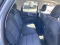 Interior view of the rear seats in a 2023 Ford Bronco Sport featuring gray fabric upholstery and a spacious layout