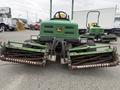 A 2009 John Deere 2653B Precision turf mower with dual cutting reels and a green body positioned in the foreground
