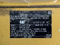 Label of a 2022 Caterpillar 306 with details on emission control information including model number engine specifications and clearance measurements