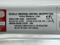 A label detailing vehicle emission control information for a 2017 Hino 338 truck including regulatory category and compliance with US EPA regulations