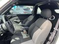 Interior of a 2005 Chrysler PT Cruiser featuring two front seats with fabric upholstery and a central console between them